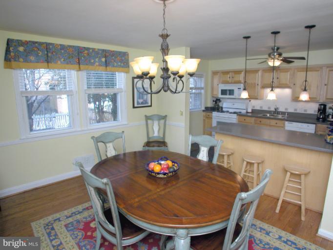 222 Gaywood Road Baltimore, MD 21212 - Photo 24 of 24 a view of a dining room with furniture wooden floor and chandelier