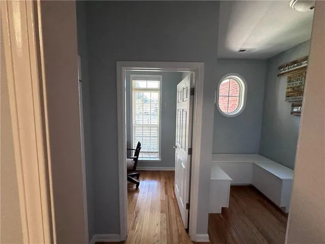 a view of entryway with wooden floor