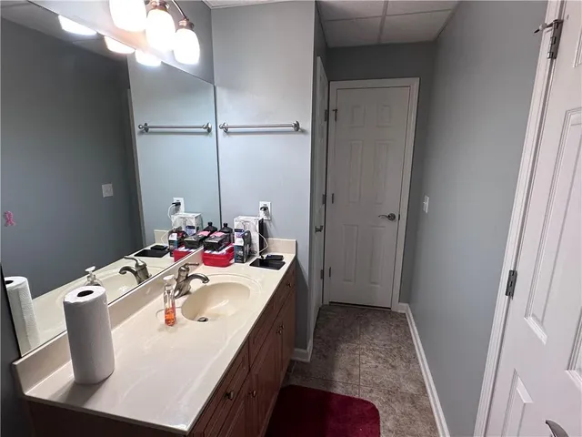 a view of a dining room with furniture and a potted plant