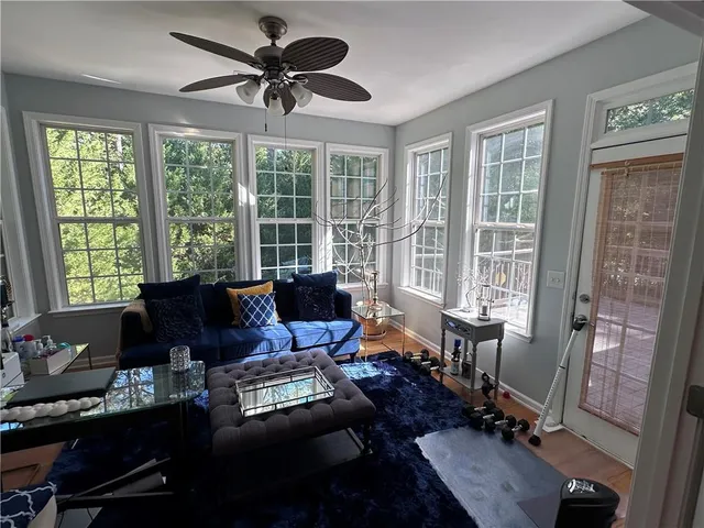 a living room with furniture and a window