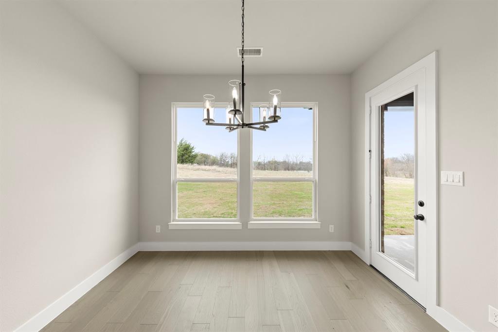 9916 Polo Pitch Lane Forney, TX 75126 - Photo 15 of 27 a view of a room with window wooden floor