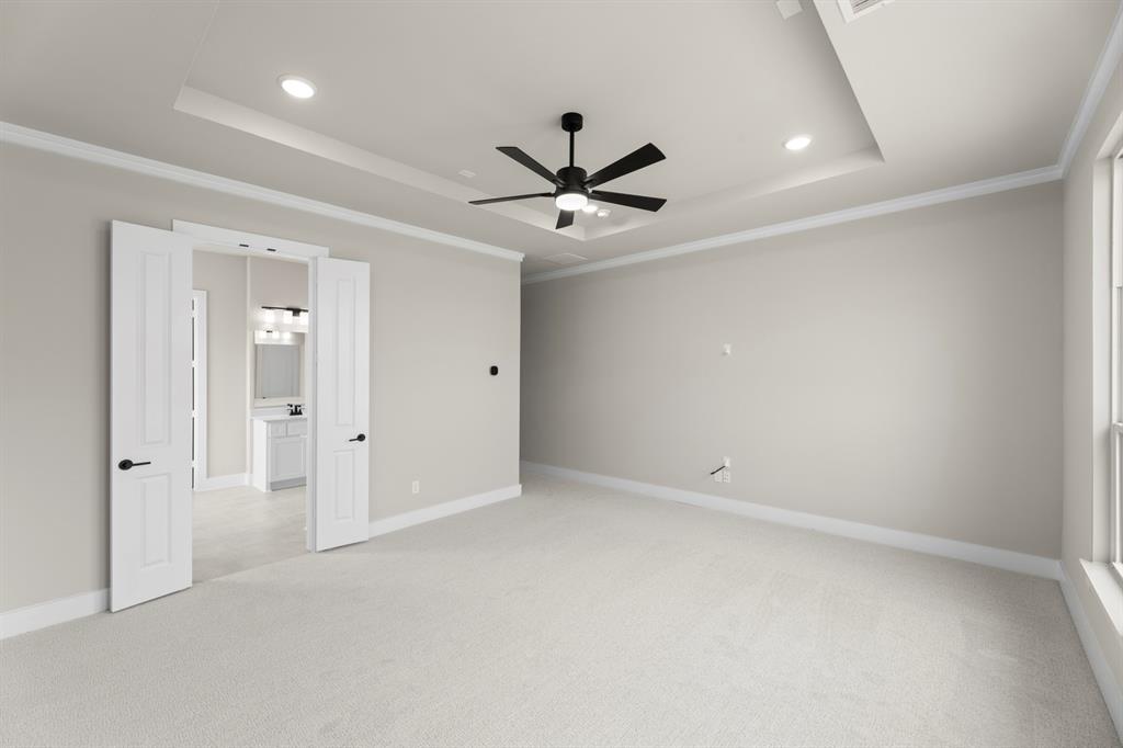 9916 Polo Pitch Lane Forney, TX 75126 - Photo 17 of 27 an empty room with fan and windows