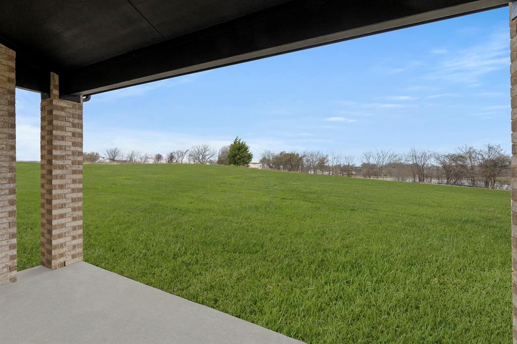 9916 Polo Pitch Lane Forney, TX 75126 - Photo 25 of 27 a view of a field with an ocean view