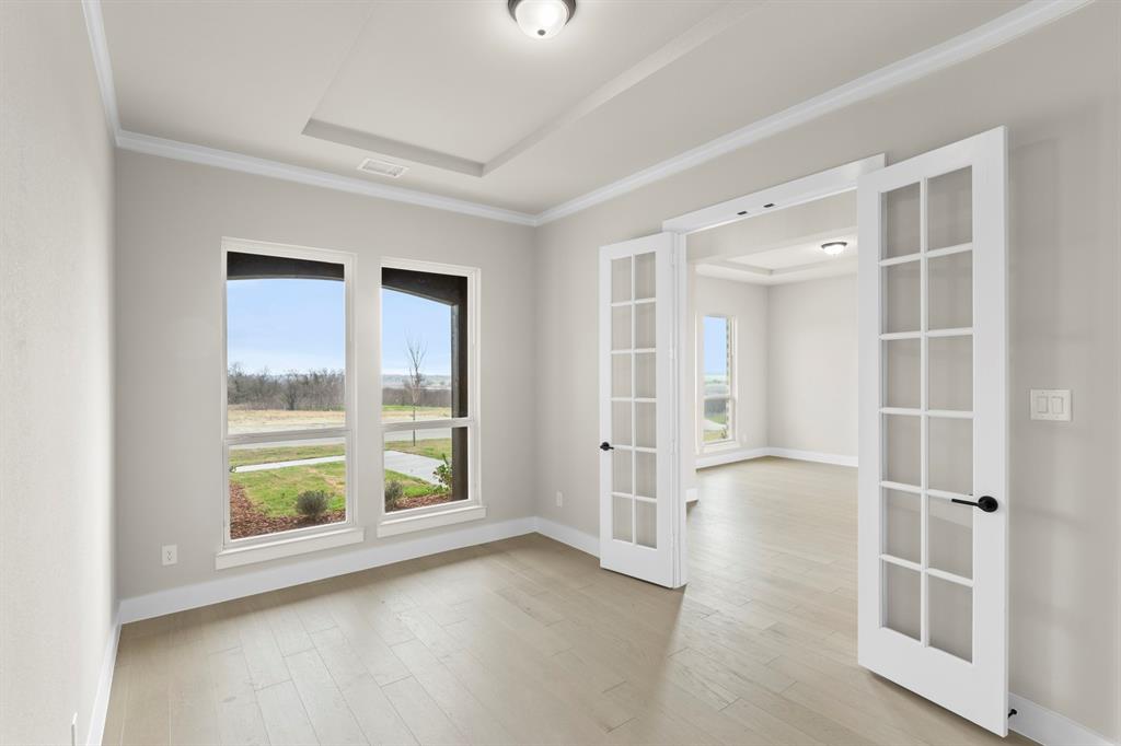 9916 Polo Pitch Lane Forney, TX 75126 - Photo 4 of 27 wooden floor in an empty room with a window