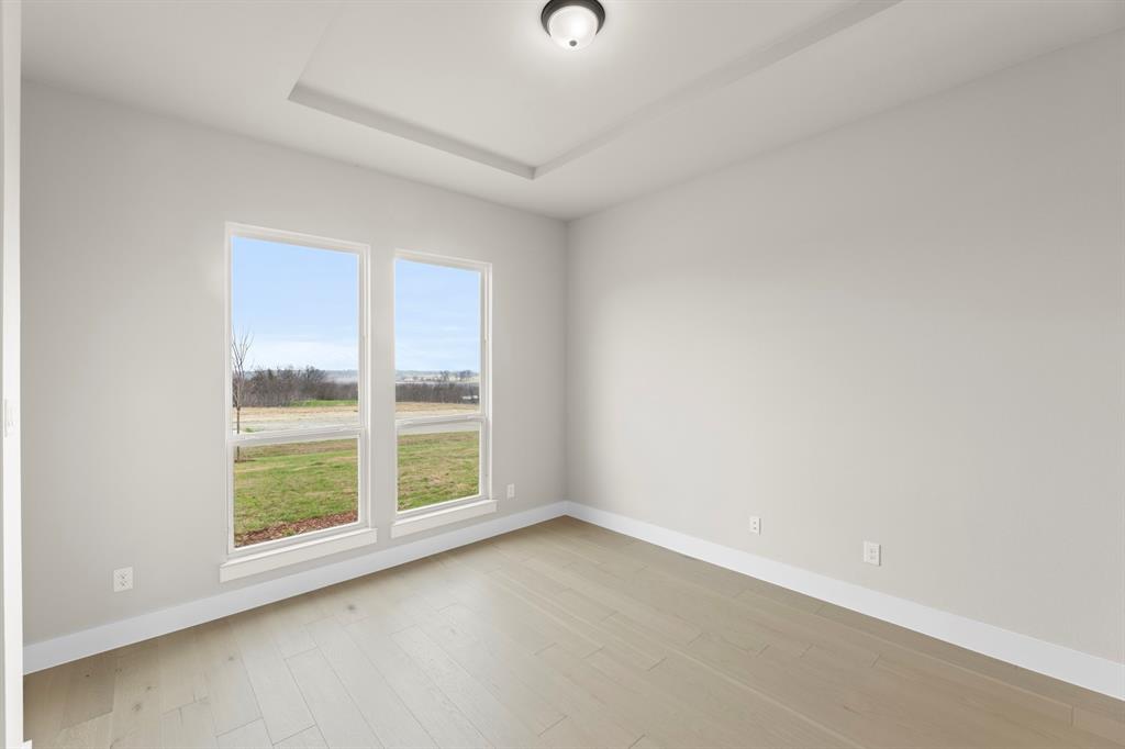 9916 Polo Pitch Lane Forney, TX 75126 - Photo 5 of 27 a view of an empty room with a window