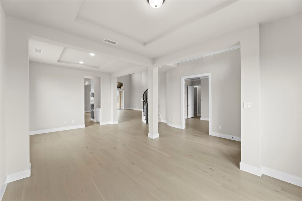 9916 Polo Pitch Lane Forney, TX 75126 - Photo 6 of 27 a view of a livingroom with wooden floor and staircase
