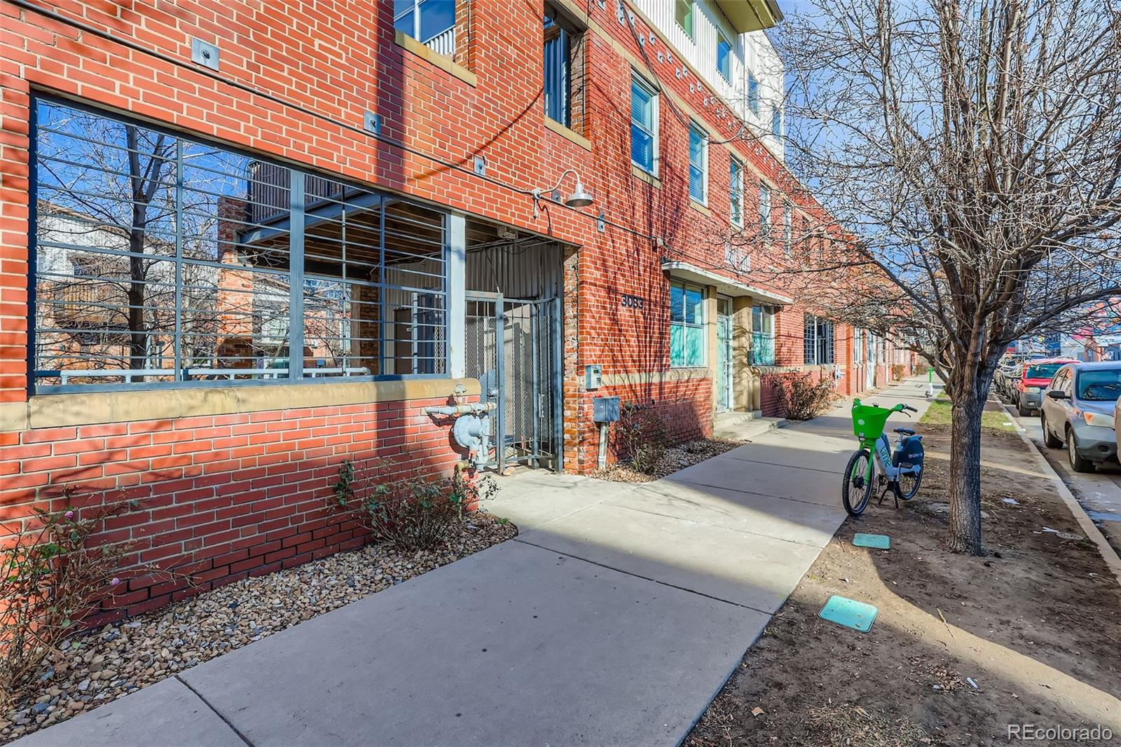 3033 Blake Street, Unit 109 Denver, CO 80205 - Photo 2 of 43 a backyard of a house with outdoor seating