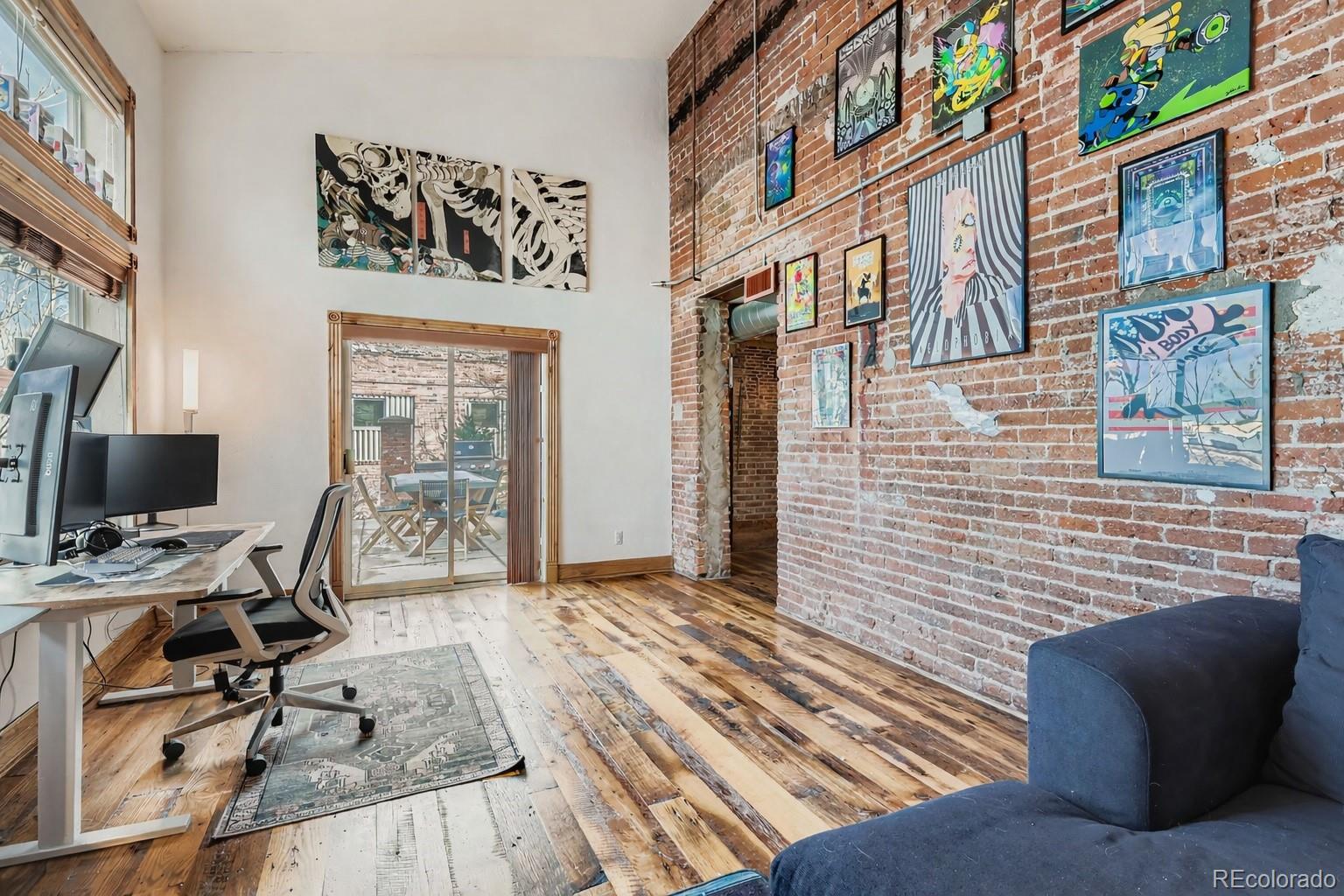 3033 Blake Street, Unit 109 Denver, CO 80205 - Photo 27 of 43 a view of a brick buildings with many windows