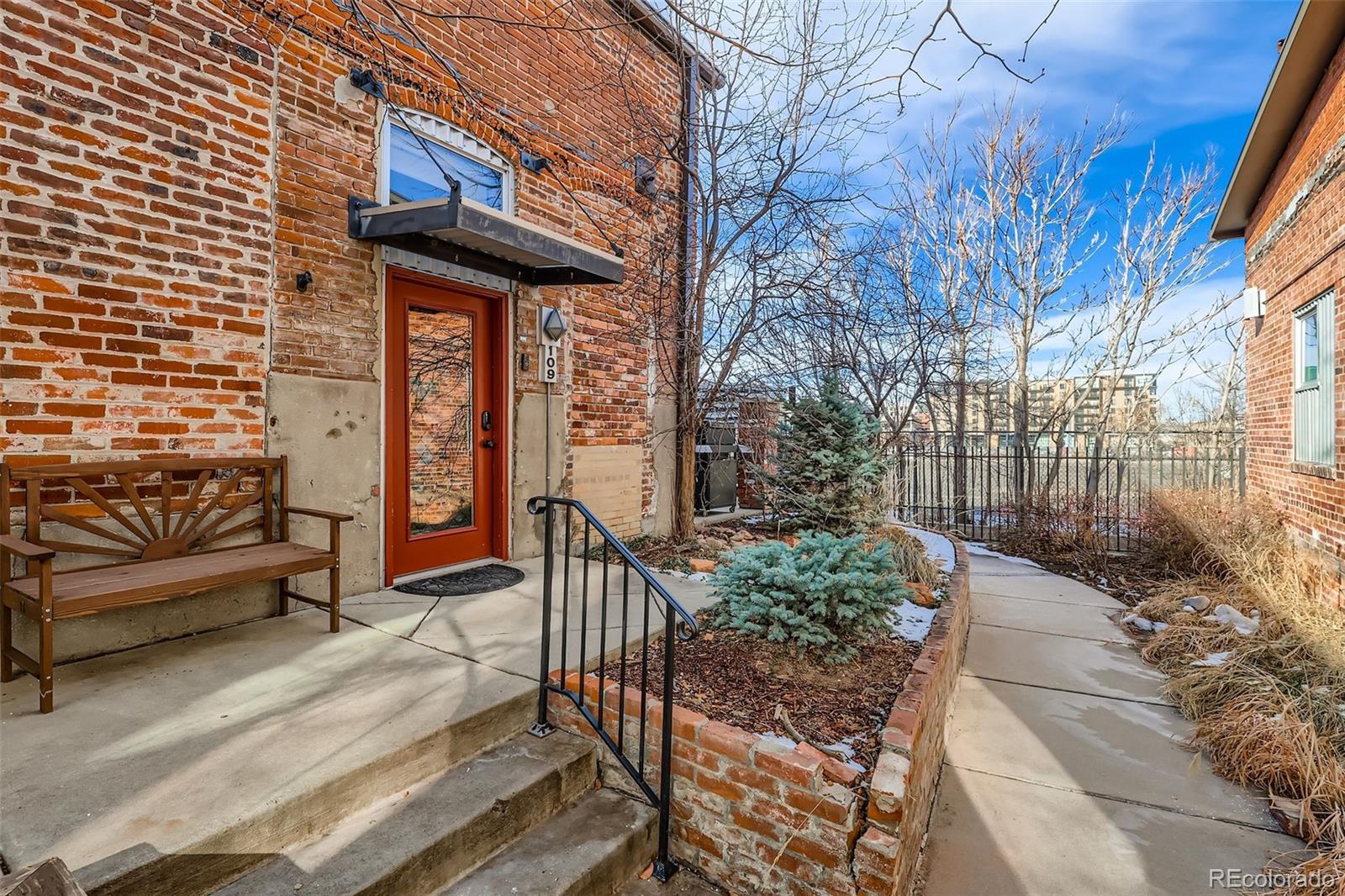 3033 Blake Street, Unit 109 Denver, CO 80205 - Photo 5 of 43 a view of a chairs and table in the patio