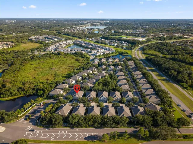 an aerial view of residential houses with outdoor space
