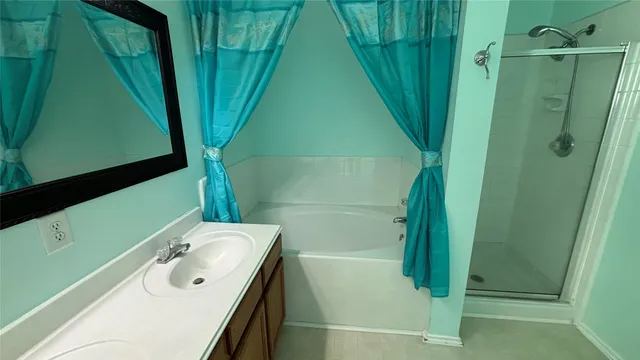 a bathroom with a sink and mirror