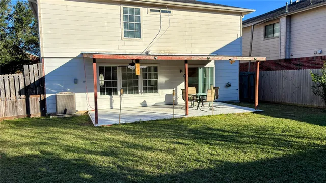 a view of a kitchen with refrigerator and microwave