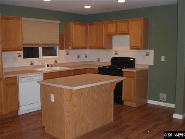a utility room with sink dryer and washer