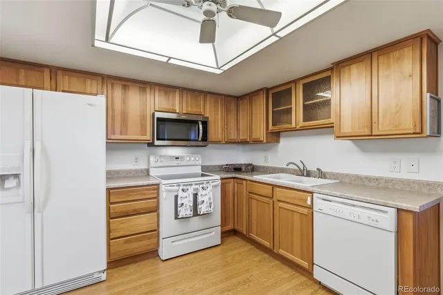 a kitchen with stainless steel appliances granite countertop a refrigerator and microwave
