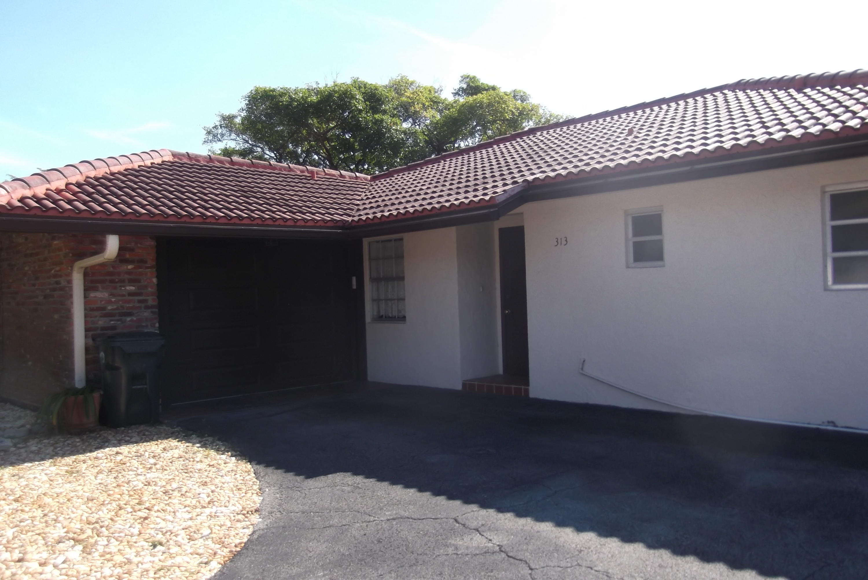 313 Northwest 42nd Street Boca Raton, FL 33431 - Photo 3 of 24 Front Door/1 car Gar
