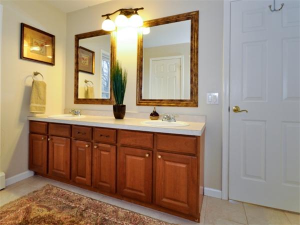 75 Ridgeway Avenue Needham, MA 02492 - Photo 17 of 22 a bathroom with a double vanity sink and a mirror