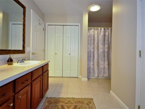75 Ridgeway Avenue Needham, MA 02492 - Photo 18 of 22 a bathroom with a granite countertop sink and a mirror