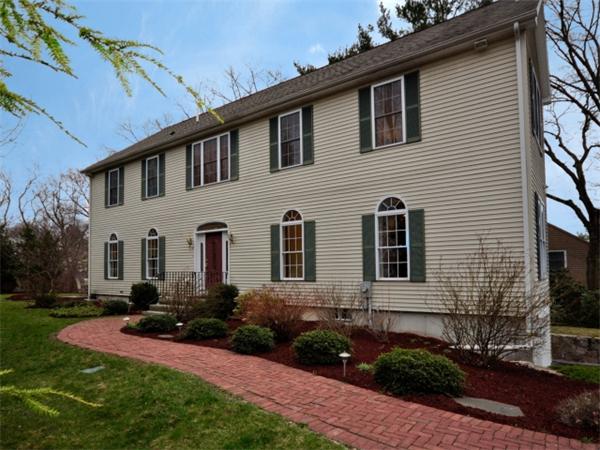 75 Ridgeway Avenue Needham, MA 02492 - Photo 2 of 22 a front view of a house with a yard