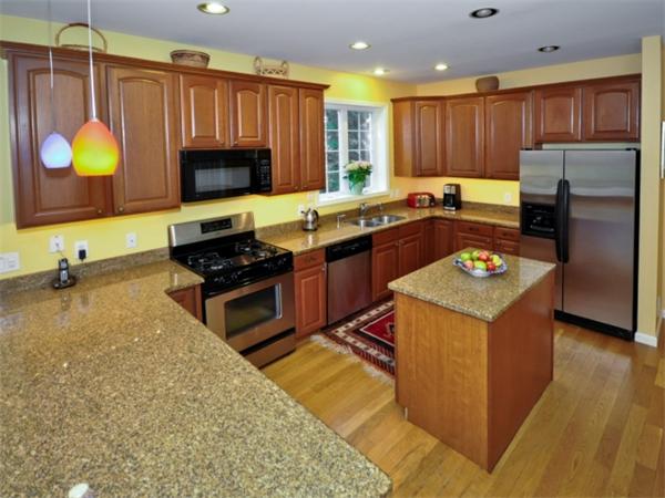 75 Ridgeway Avenue Needham, MA 02492 - Photo 6 of 22 a kitchen with granite countertop a stove sink and cabinets
