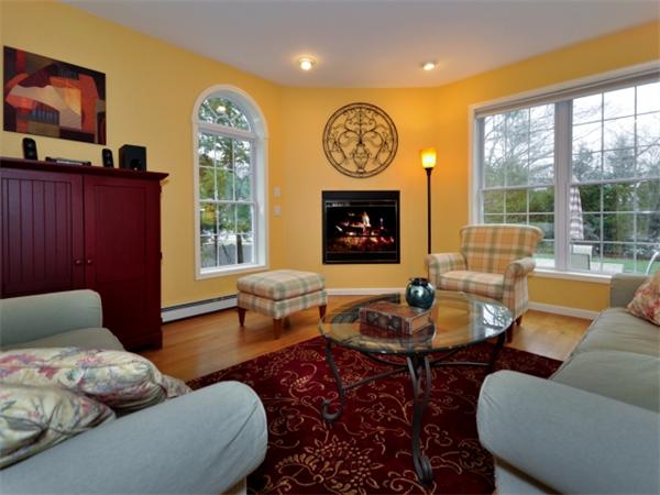 75 Ridgeway Avenue Needham, MA 02492 - Photo 9 of 22 a living room with furniture and a fireplace
