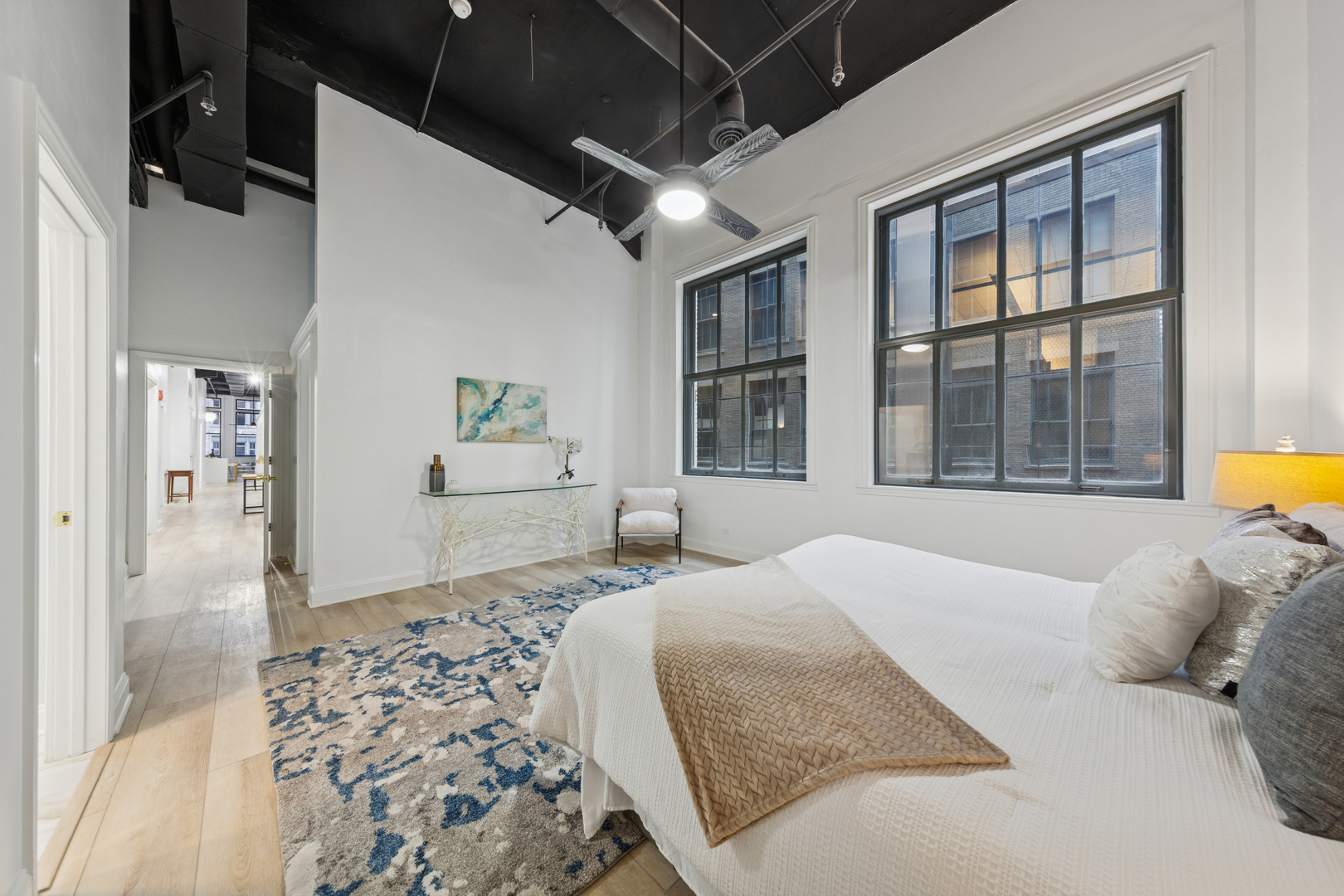 120 South State Street, Unit 4 Chicago, IL 60603 - Photo 15 of 28 a bedroom with a large bed and a window