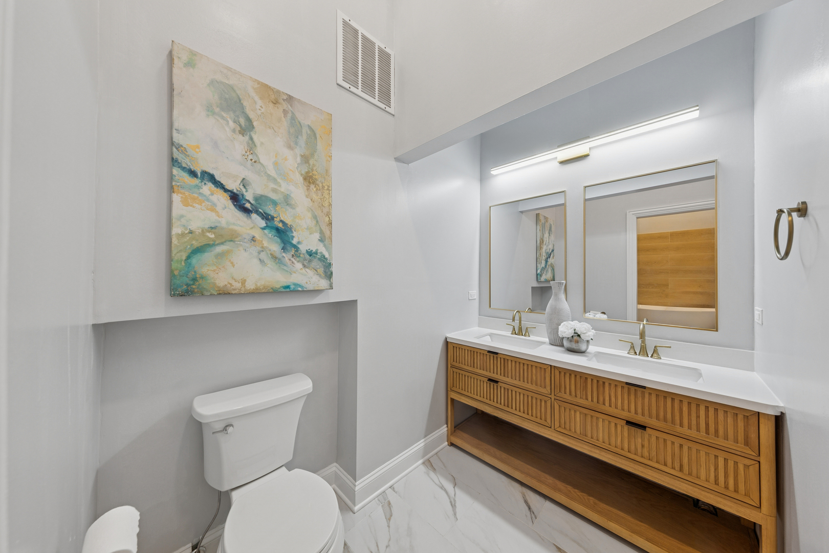 120 South State Street, Unit 4 Chicago, IL 60603 - Photo 16 of 28 a bathroom with a toilet a sink and mirror