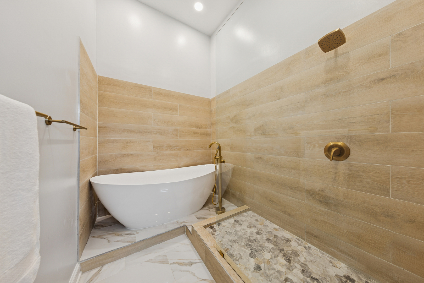 120 South State Street, Unit 4 Chicago, IL 60603 - Photo 17 of 28 a bathroom with a bathtub and shower