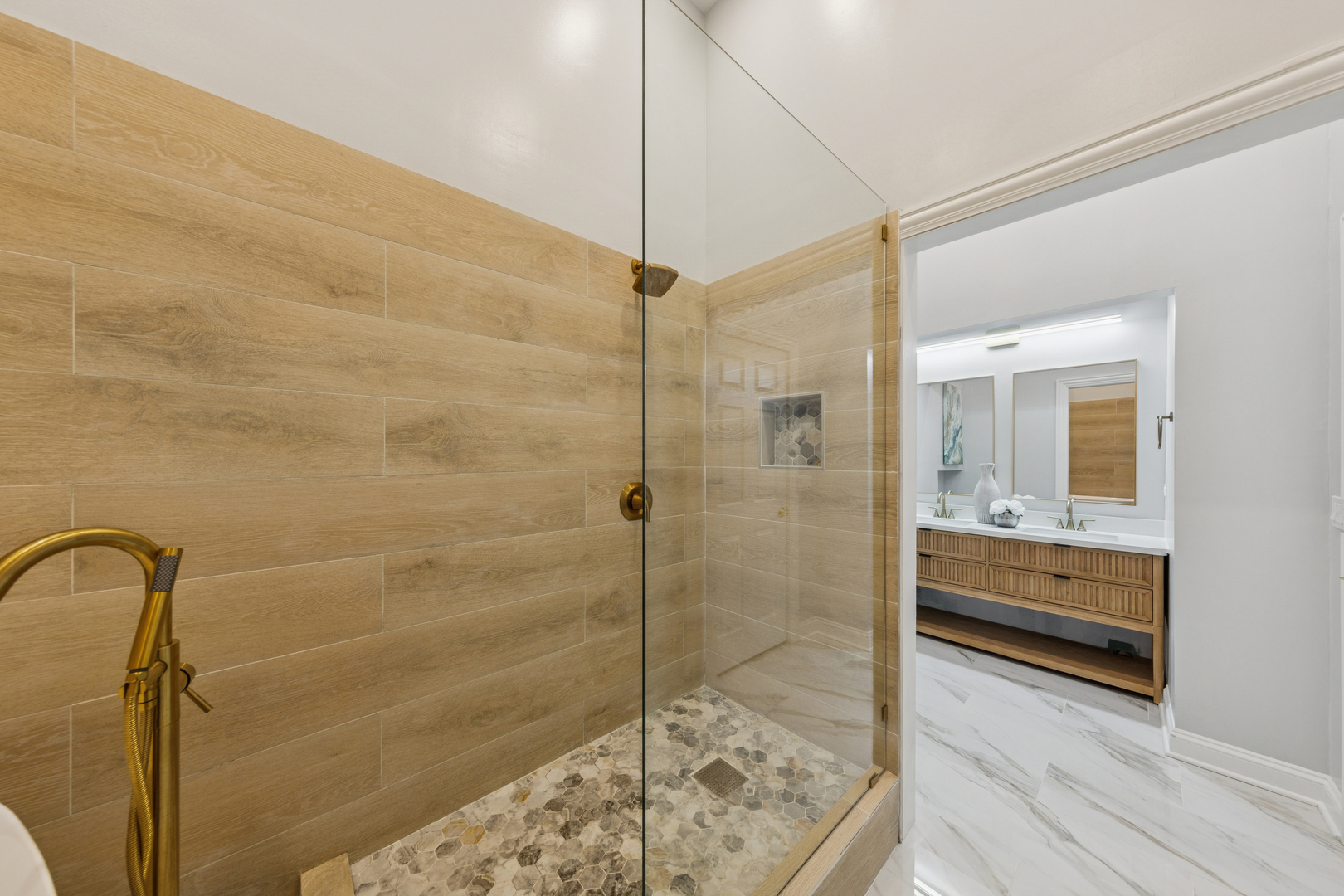 120 South State Street, Unit 4 Chicago, IL 60603 - Photo 18 of 28 a bathroom with a shower and mirror