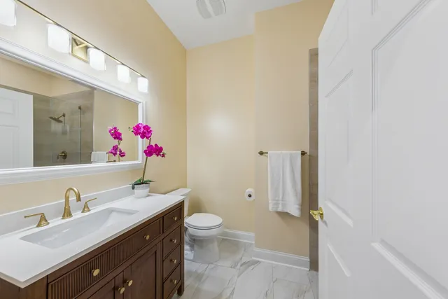 a bathroom with a shower and a sink