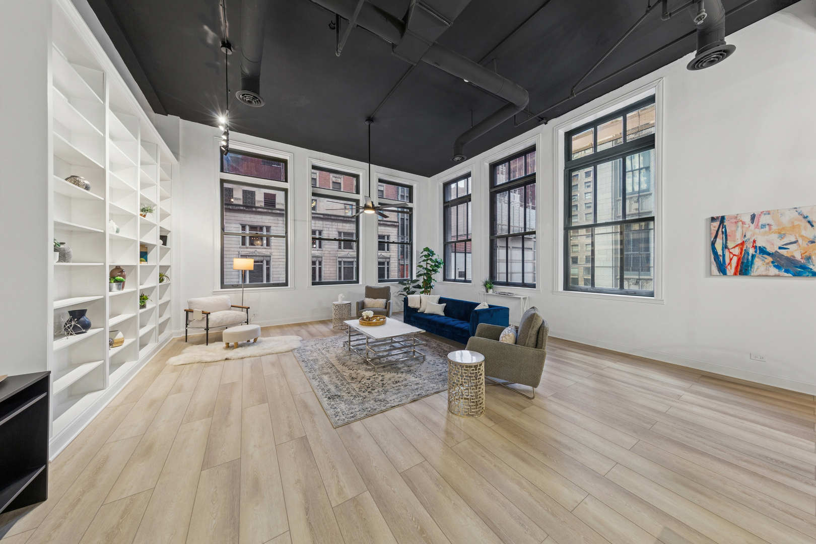 120 South State Street, Unit 4 Chicago, IL 60603 - Photo 26 of 28 a living room with furniture large window and wooden floor