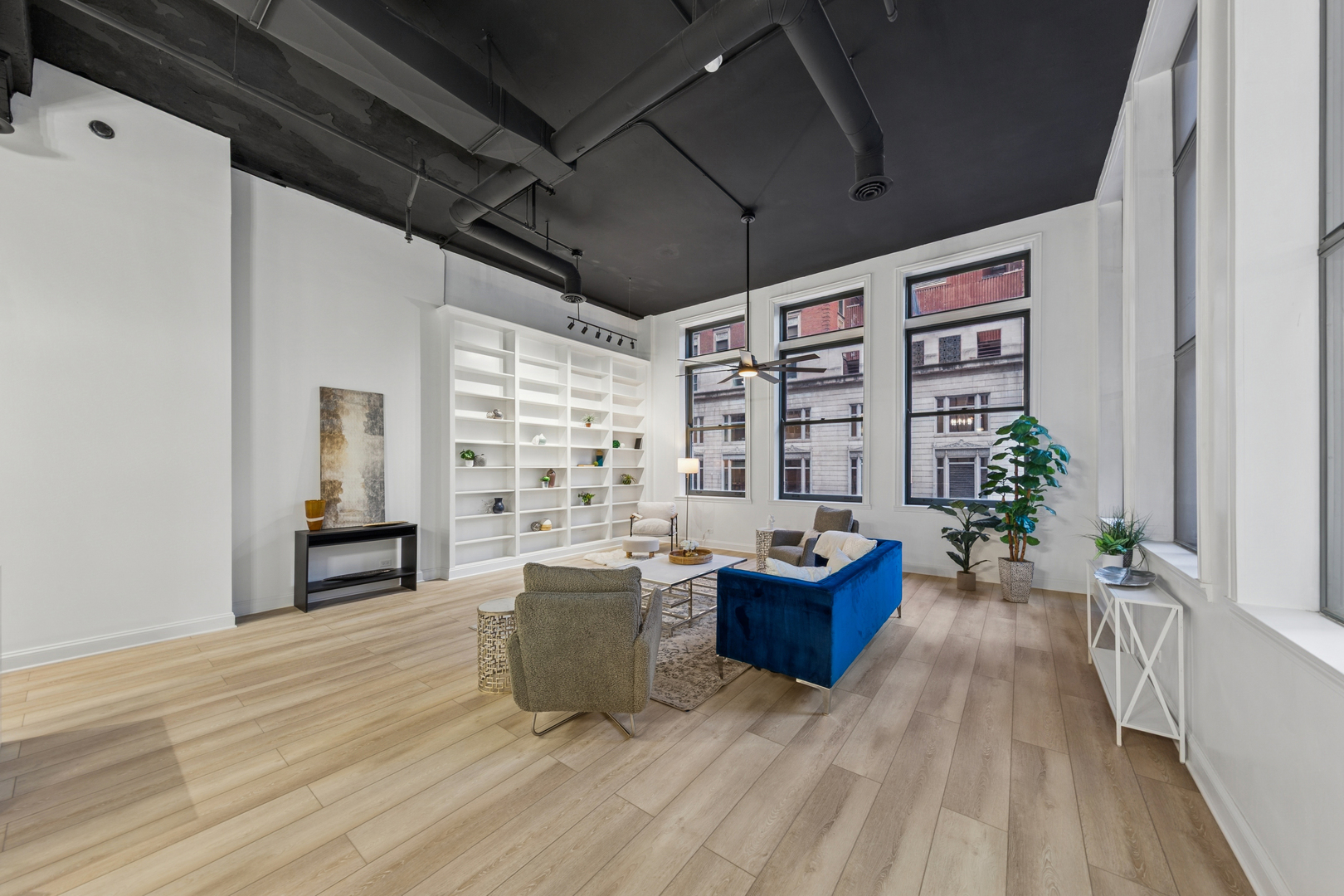120 South State Street, Unit 4 Chicago, IL 60603 - Photo 27 of 28 a living room with furniture large window and wooden floor