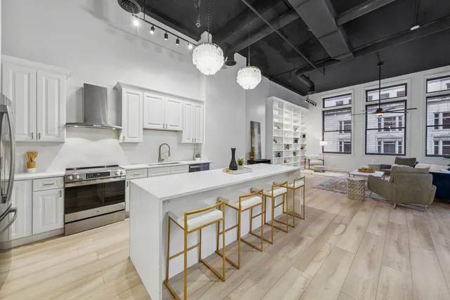 a kitchen with a dining table and chairs