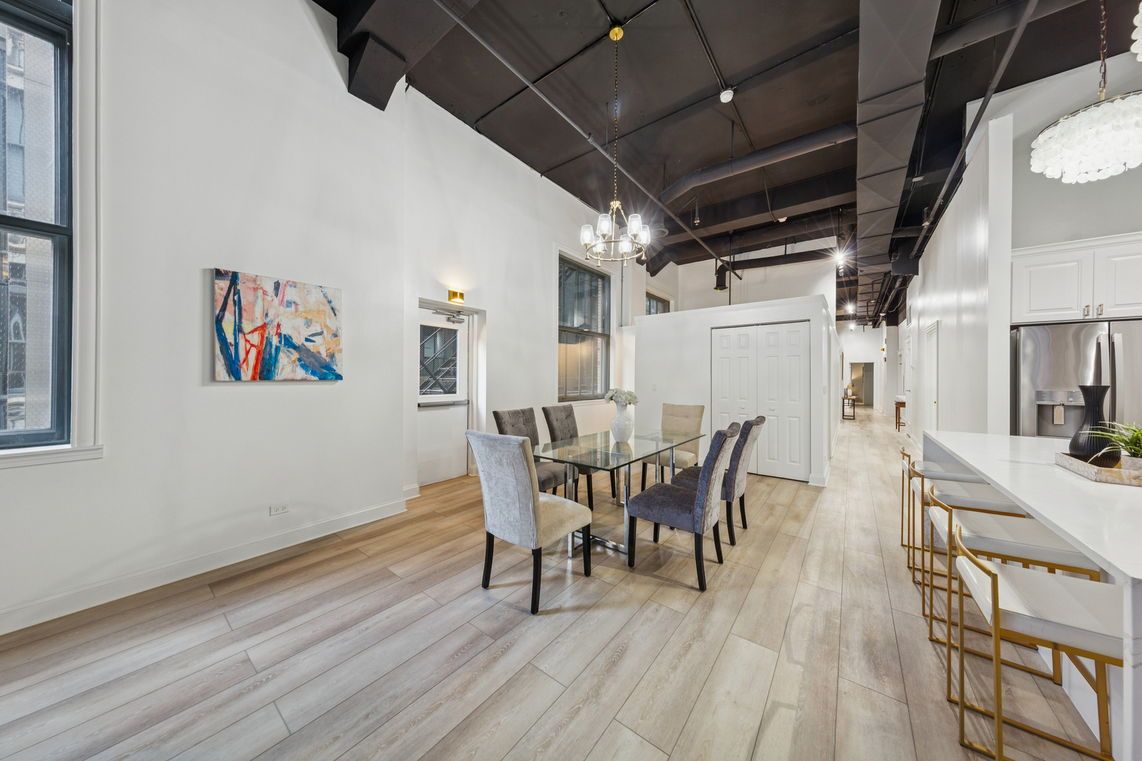 120 South State Street, Unit 4 Chicago, IL 60603 - Photo 7 of 28 a view of a dining room with furniture and wooden floor
