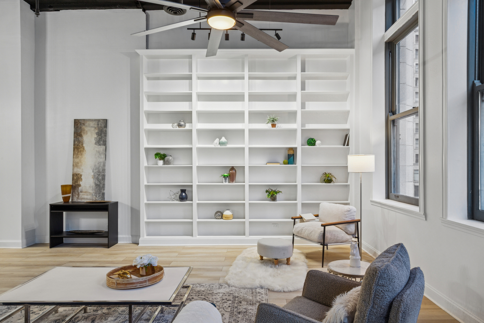 120 South State Street, Unit 4 Chicago, IL 60603 - Photo 8 of 28 a living room with furniture and a book shelf