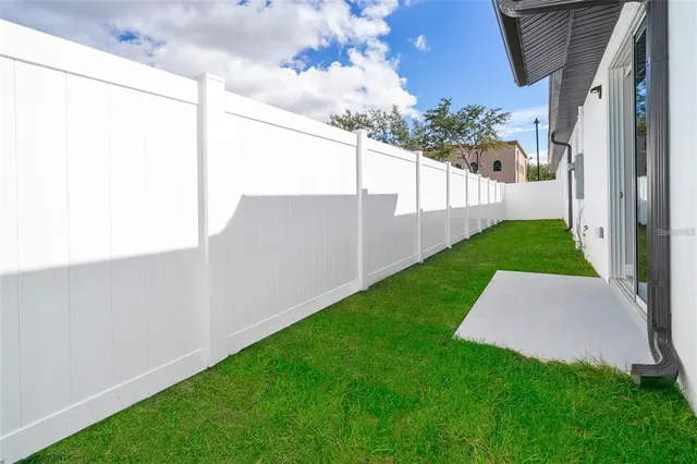 an aerial view of houses with an outdoor space