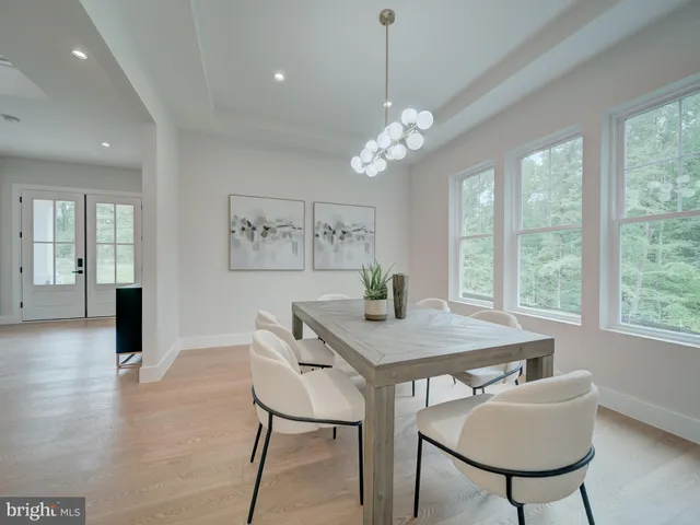 a kitchen with white cabinets and appliances