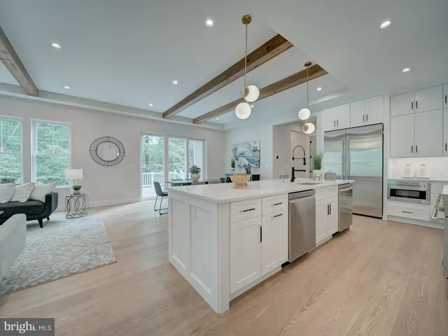 a kitchen with a stove a sink and a refrigerator