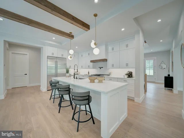 a living room with furniture fireplace and window