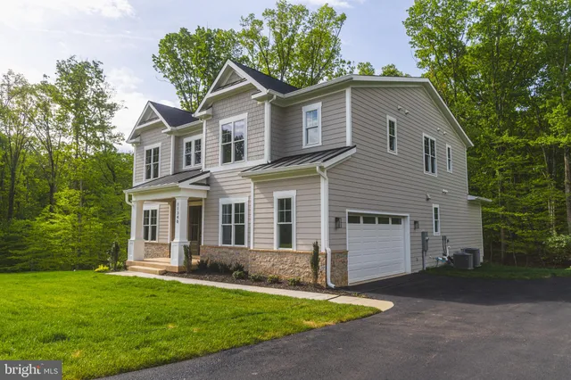 a view of entryway and hall with dining room