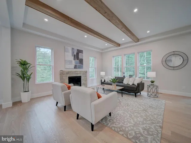 a living room with furniture and a chair