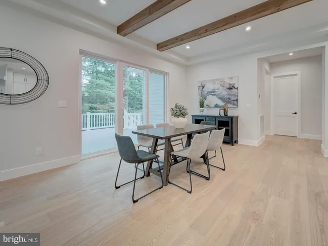 a spacious bedroom with a bed couch and a large window