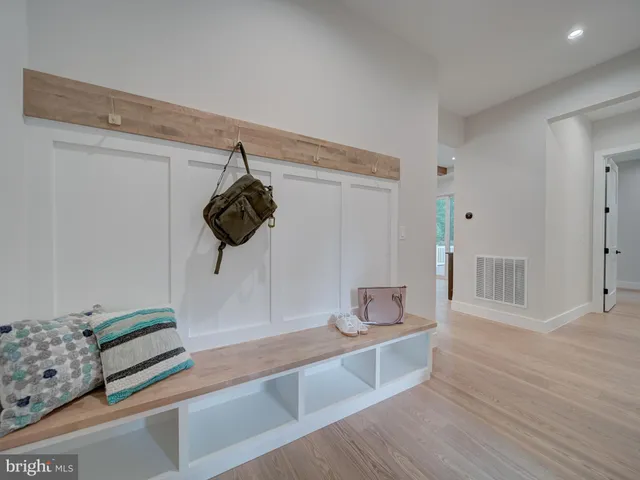 a bedroom with a bed and a ceiling fan