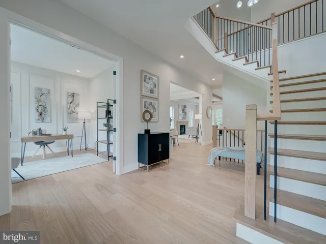 a living room with furniture flowerpot and a potted plant