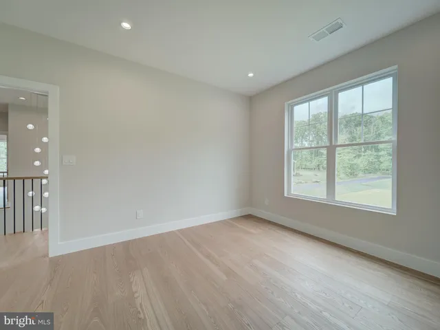 a view of backyard with deck and wooden floor