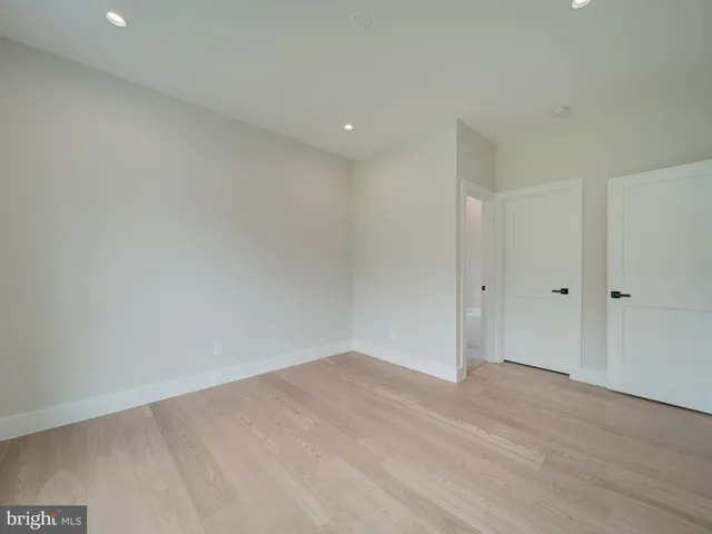 a view of backyard with deck and wooden floor
