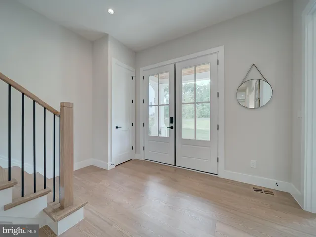a view of a livingroom with furniture window and wooden floor