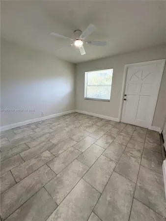 a view of an empty room and window