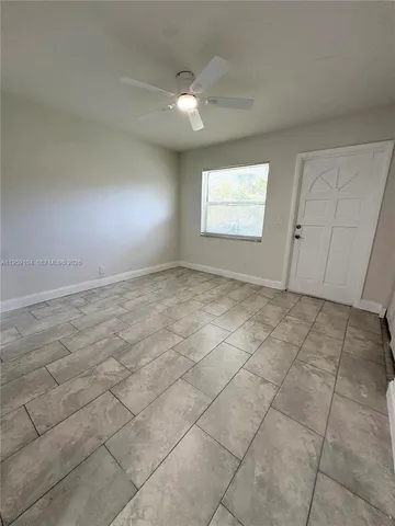 a view of an empty room and window