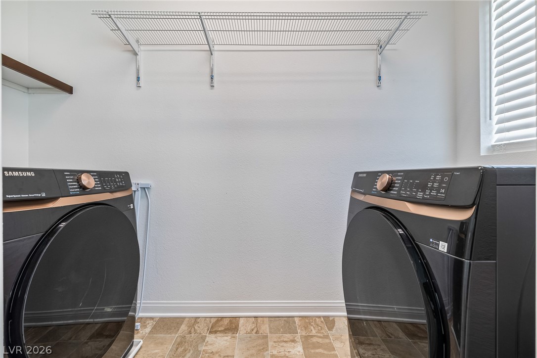 5510 Ripple Ridge Avenue Las Vegas, NV 89139 - Photo 39 of 45 This dedicated laundry space offers practical solutions for everyday tasks.
