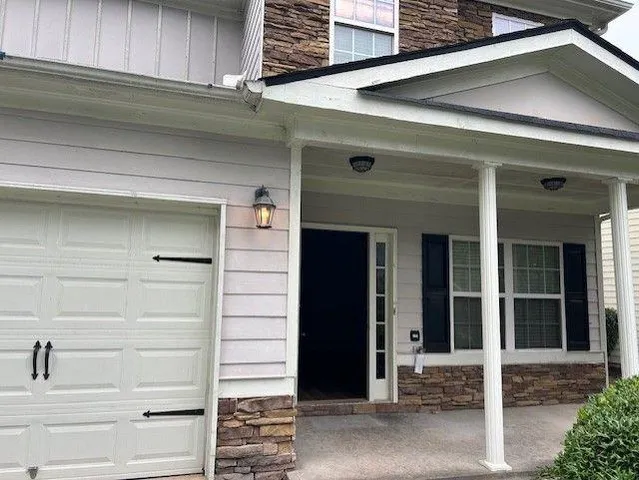 a front view of a house with a garage